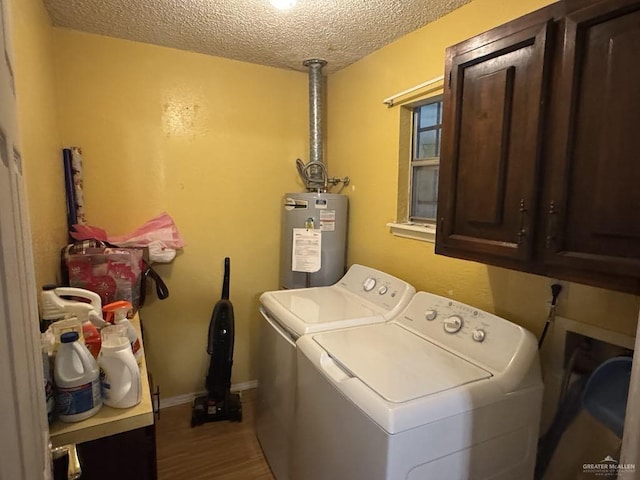 1308 E 2nd St, Weslaco, TX 78596 - laundry room featuring electric water heater, cabinet space, independent washer and dryer, a textured ceiling, and wood finished floors