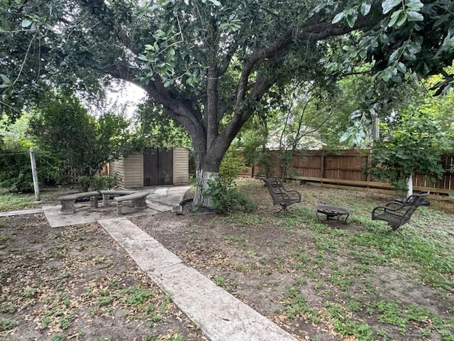 1308 E 2nd St, Weslaco, TX 78596 - view of yard featuring an outdoor fire pit and an outdoor structure
