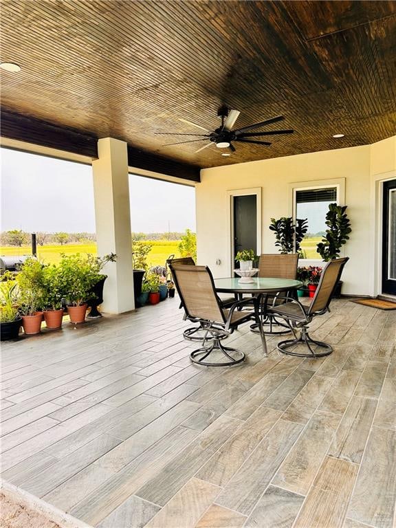 exterior space featuring ceiling fan