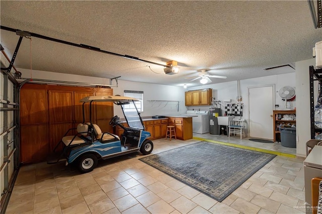 512 Mercury St, Mission, TX 78572 - garage featuring a garage door opener, a ceiling fan, independent washer and dryer, and a sink