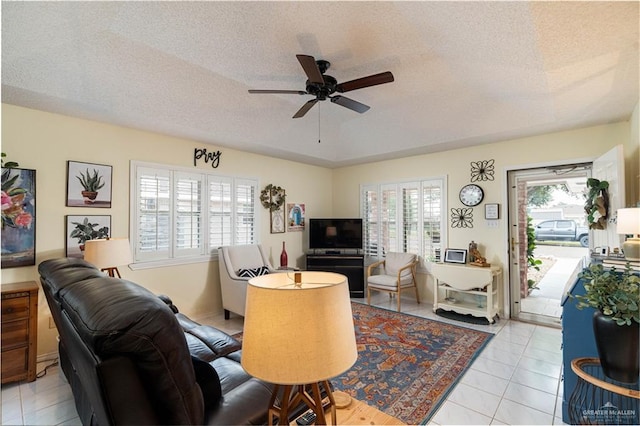 512 Mercury St, Mission, TX 78572 - tiled living room with a textured ceiling and a ceiling fan