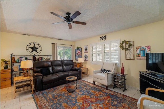 512 Mercury St, Mission, TX 78572 - tiled living room featuring a ceiling fan and a textured ceiling