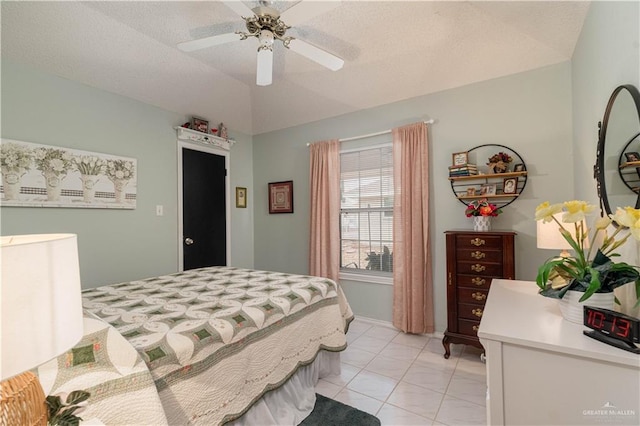 512 Mercury St, Mission, TX 78572 - bedroom with light tile patterned flooring, lofted ceiling, ceiling fan, and a textured ceiling