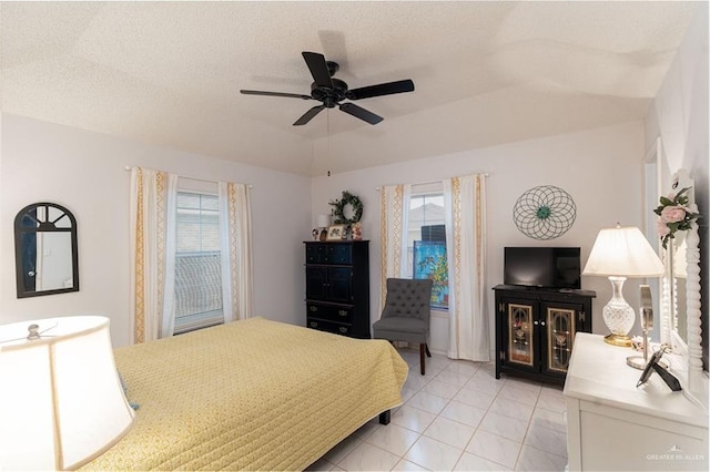512 Mercury St, Mission, TX 78572 - bedroom with multiple windows, ceiling fan, and light tile patterned flooring