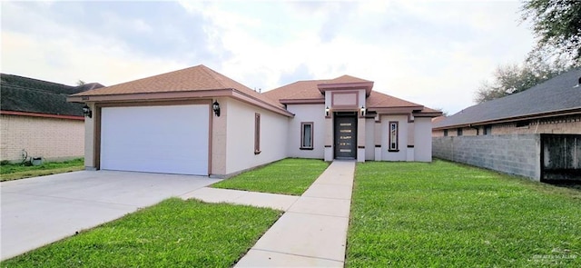 view of front of property with an attached garage, concrete driveway, roof with shingles, stucco siding, and a front yard