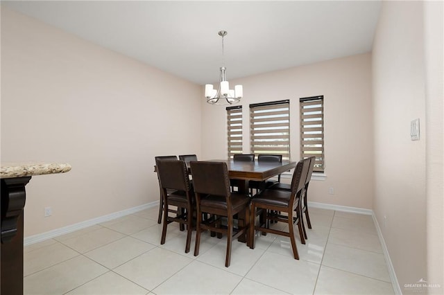 tiled dining area with an inviting chandelier