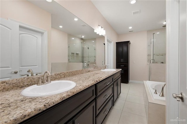 bathroom featuring tile patterned floors, vanity, and independent shower and bath