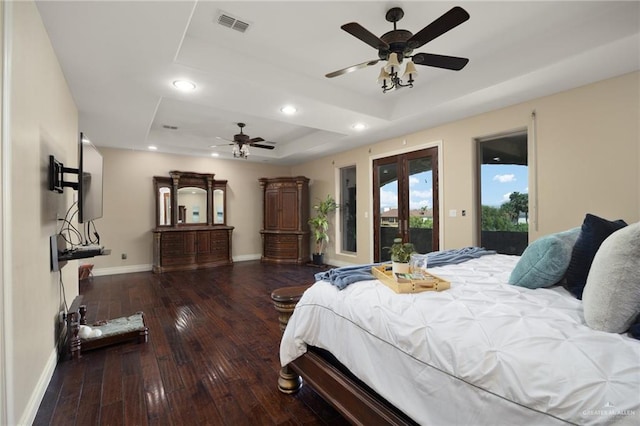 bedroom featuring a raised ceiling, access to exterior, ceiling fan, and dark hardwood / wood-style floors