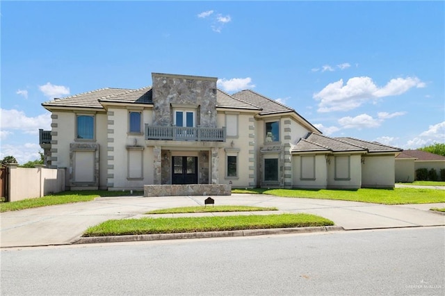 view of front of home with a balcony