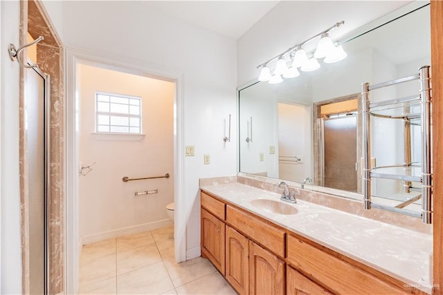 full bathroom featuring vanity, tile patterned floors, toilet, and baseboards