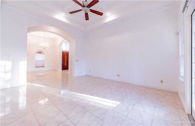 spare room featuring recessed lighting, ceiling fan with notable chandelier, arched walkways, and ornamental molding