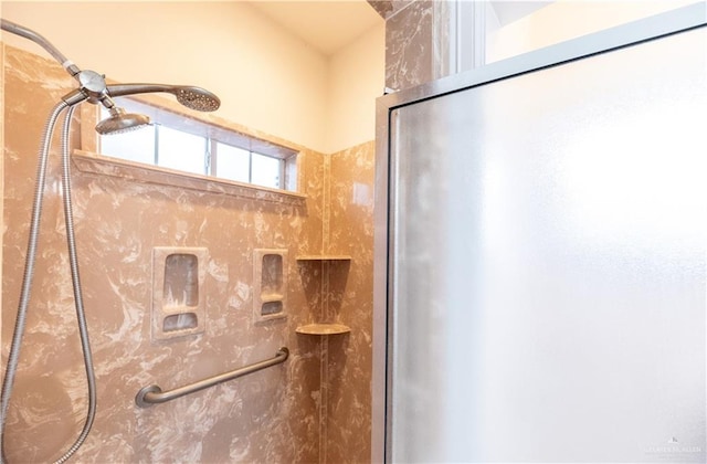 full bathroom featuring a shower with shower door