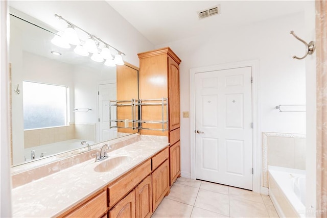 full bath with vanity, tile patterned floors, a bath, and visible vents