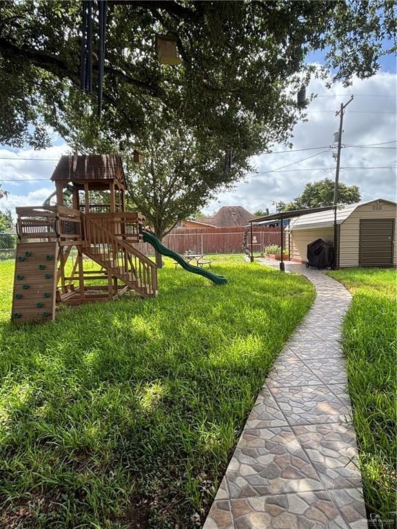 1106 17th St, Mcallen, TX 78501 - view of yard with a playground and a shed