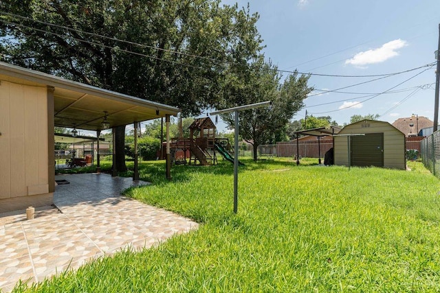 1106 17th St, Mcallen, TX 78501 - fenced backyard with a playground, a storage shed, and a patio area