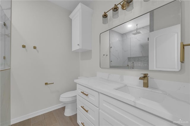 bathroom featuring vanity, toilet, and walk in shower