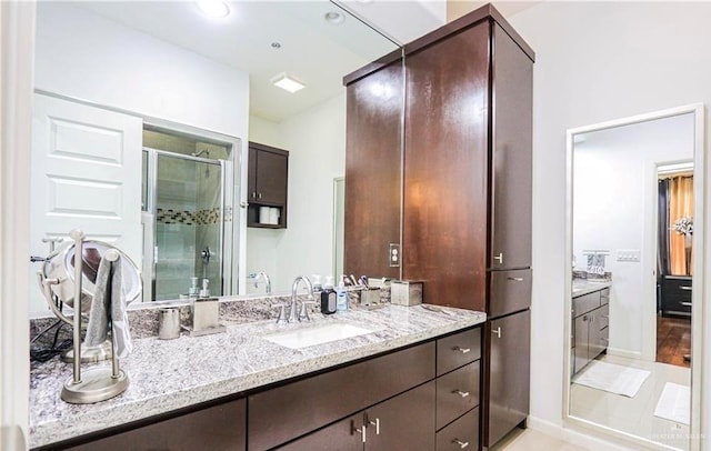 bathroom with vanity and walk in shower