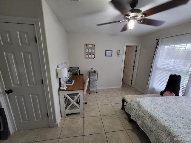 bedroom with ceiling fan and light tile patterned floors