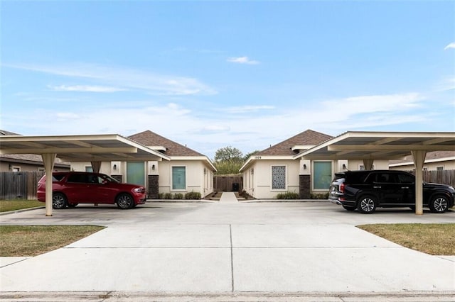 1909 Taft St, Weslaco, TX 78596 - view of front of house with fence and stucco siding