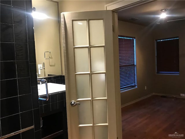 1316 W Maple Ave, Mcallen, TX 78501 - bathroom with wood finished floors and baseboards