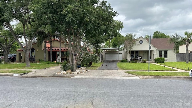 1316 W Maple Ave, Mcallen, TX 78501 - view of property hidden behind natural elements featuring asphalt driveway and a front lawn