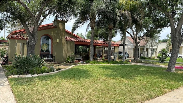 1316 W Maple Ave, Mcallen, TX 78501 - view of front of home featuring a front yard, stucco siding, and a tile roof