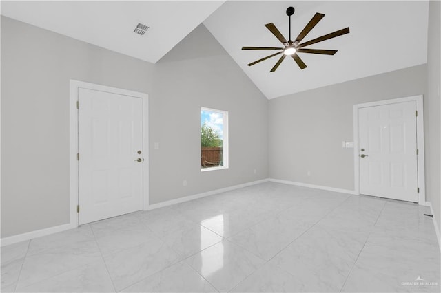 spare room with marble finish floor, visible vents, ceiling fan, and baseboards