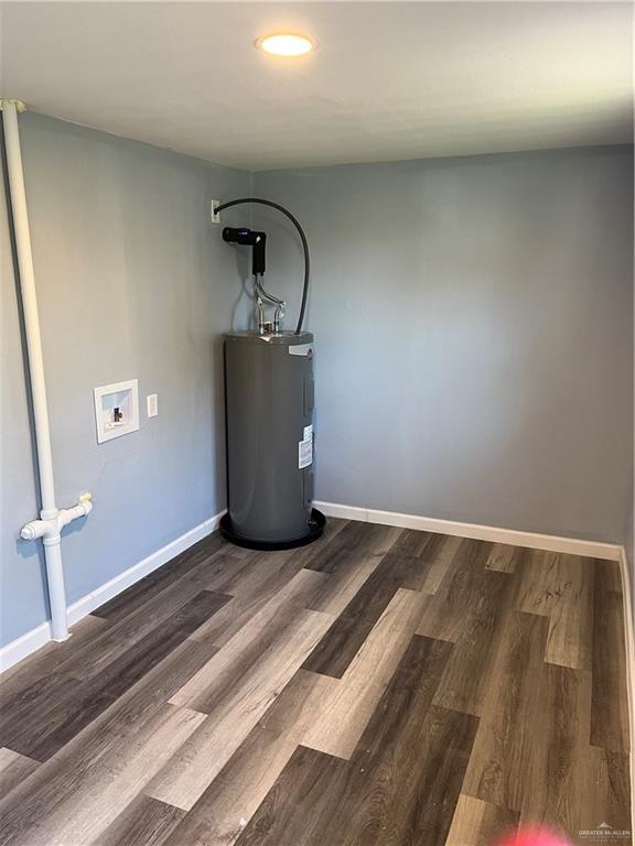 306 W 3rd St, San Juan, TX 78589 - utility room with water heater