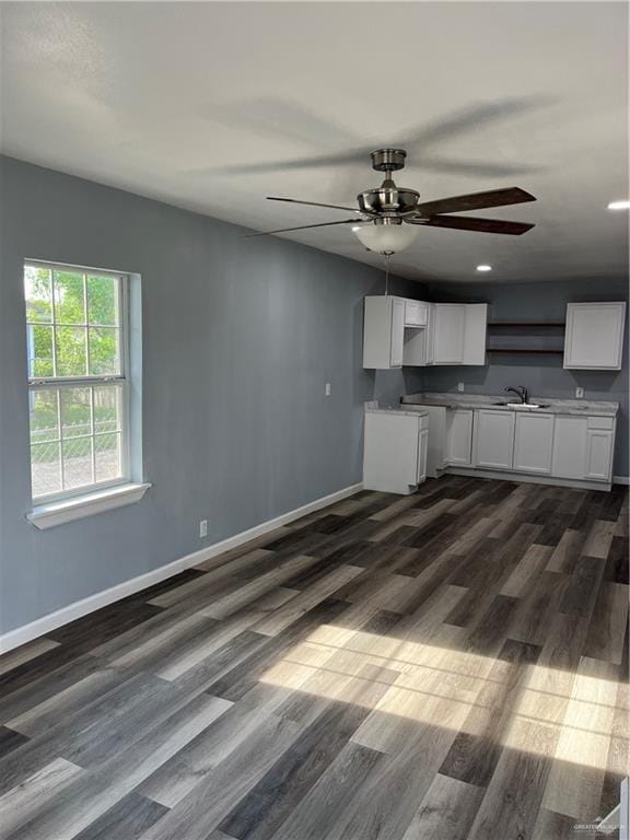 306 W 3rd St, San Juan, TX 78589 - kitchen with a sink, white cabinets, a ceiling fan, and dark wood-style floors