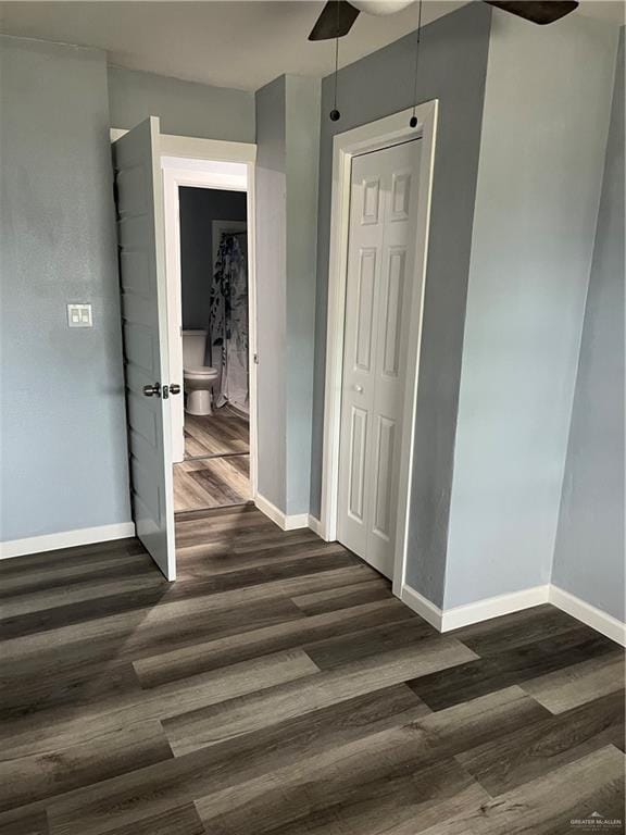 306 W 3rd St, San Juan, TX 78589 - corridor featuring baseboards and dark wood-style flooring