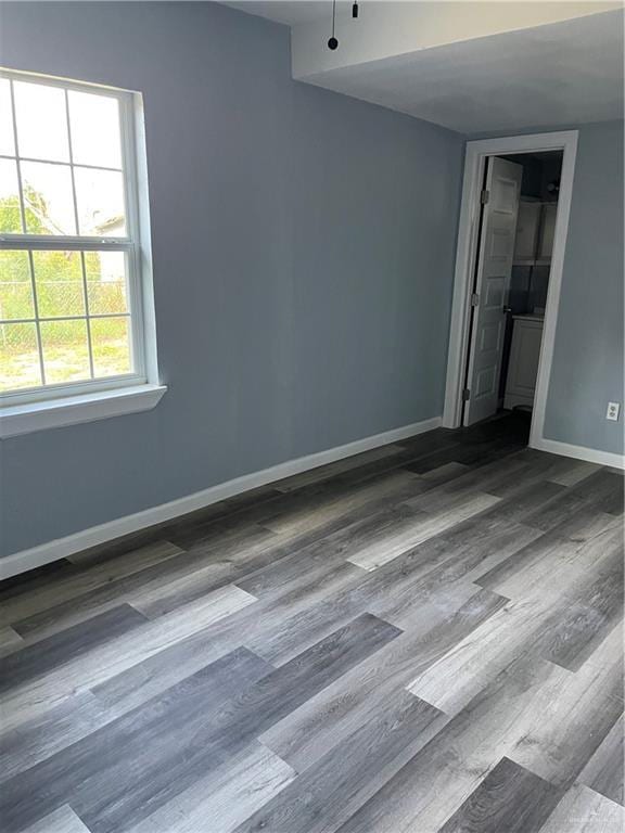 306 W 3rd St, San Juan, TX 78589 - unfurnished room with baseboards and wood finished floors