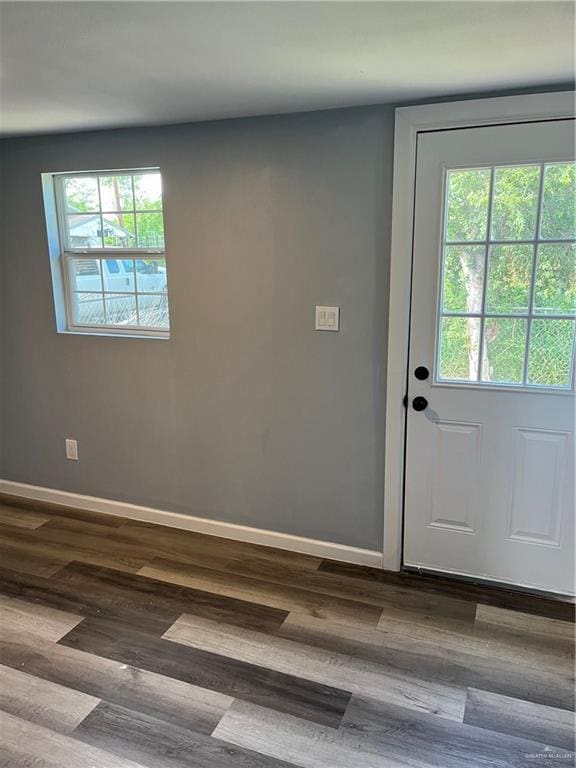 306 W 3rd St, San Juan, TX 78589 - entryway with a healthy amount of sunlight, baseboards, and wood finished floors