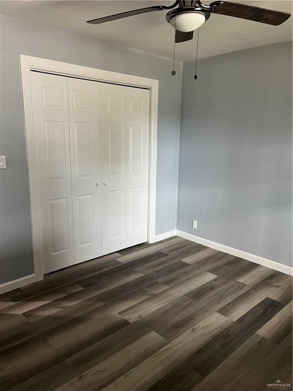 306 W 3rd St, San Juan, TX 78589 - unfurnished bedroom featuring dark wood-type flooring, a ceiling fan, baseboards, and a closet