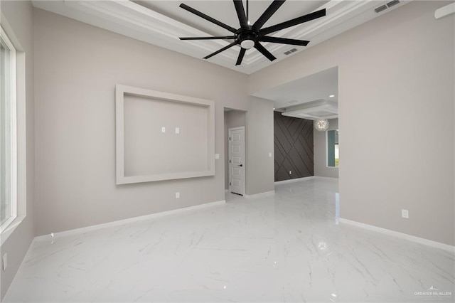 spare room with visible vents, baseboards, and marble finish floor