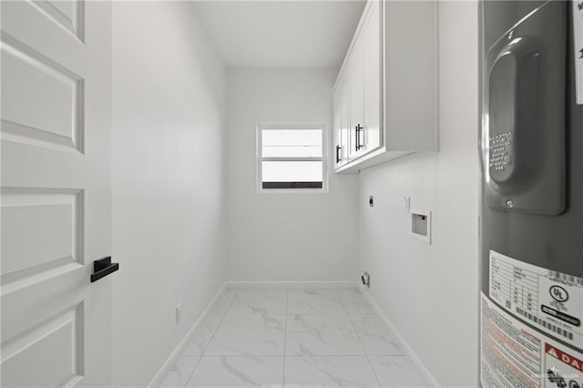 laundry room featuring marble finish floor, hookup for an electric dryer, cabinet space, and baseboards