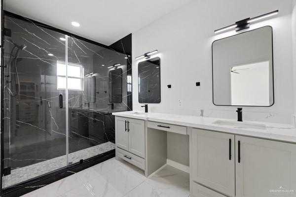 bathroom with an enclosed shower and vanity