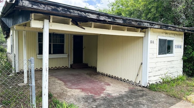 816 N Carlson St, Elsa, TX 78543 - view of front of home with an attached carport and driveway