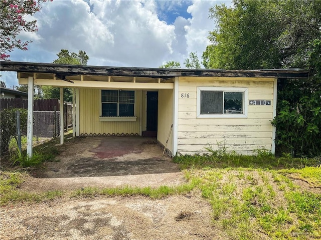 816 N Carlson St, Elsa, TX 78543 - bungalow-style home featuring an attached carport