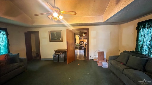816 N Carlson St, Elsa, TX 78543 - living room featuring a ceiling fan and a raised ceiling