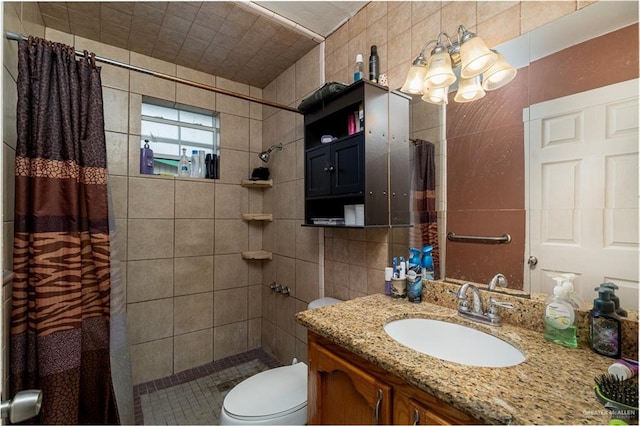 949 S Gumwood St, La Villa, TX 78562 - full bathroom featuring a tile shower, tile walls, toilet, and vanity
