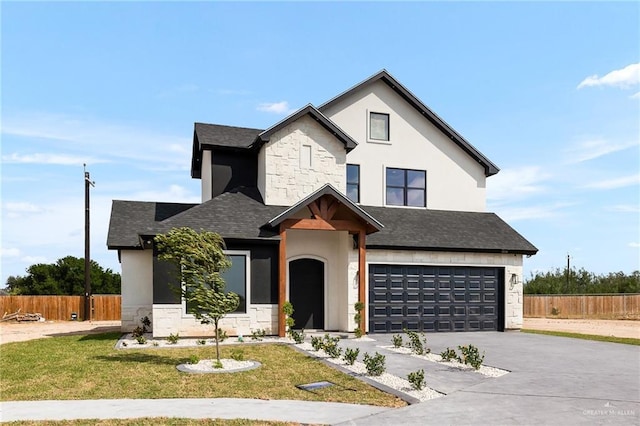 view of front of house with a front lawn and a garage