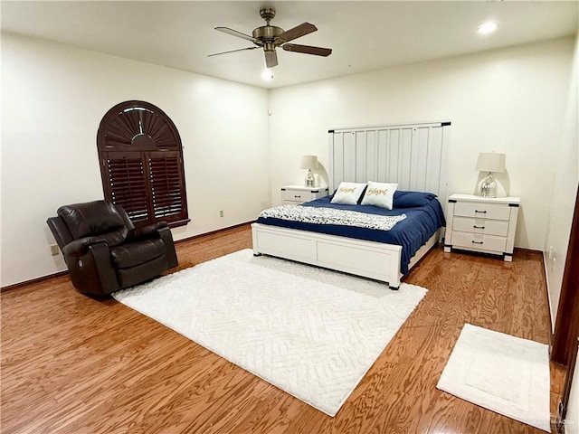 6101 Mile 7 Rd, Mission, TX 78573 - bedroom with wood finished floors, a ceiling fan, baseboards, and recessed lighting