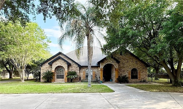 6101 Mile 7 Rd, Mission, TX 78573 - view of front of home featuring a front yard and brick siding