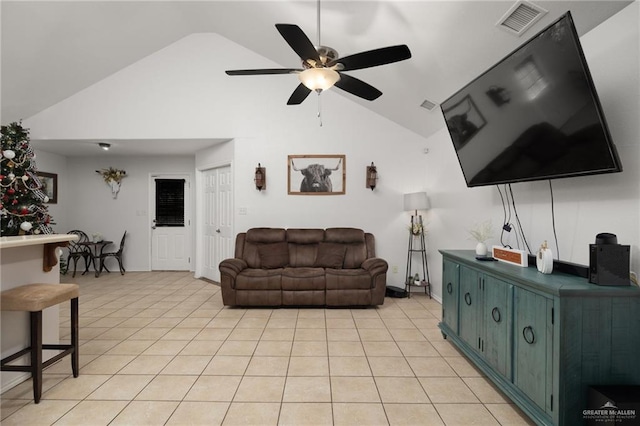 living room with vaulted ceiling, ceiling fan, and light tile patterned flooring