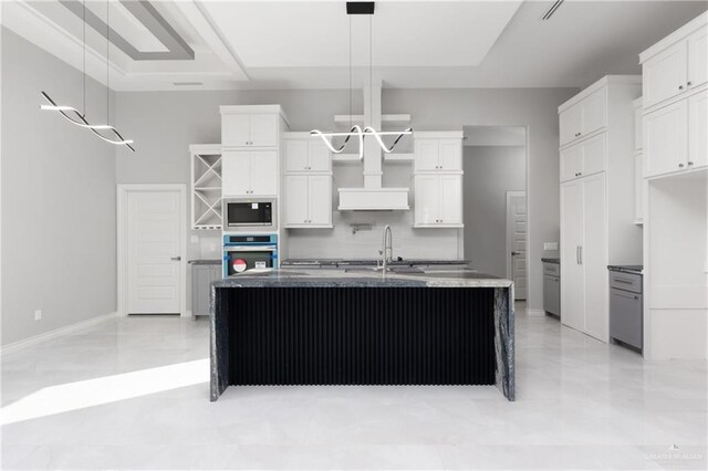 528 Candela St, Edinburg, TX 78542 - kitchen with stainless steel appliances, tasteful backsplash, white cabinetry, and open shelves