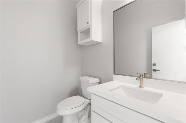 528 Candela St, Edinburg, TX 78542 - bathroom featuring baseboards, vanity, and toilet