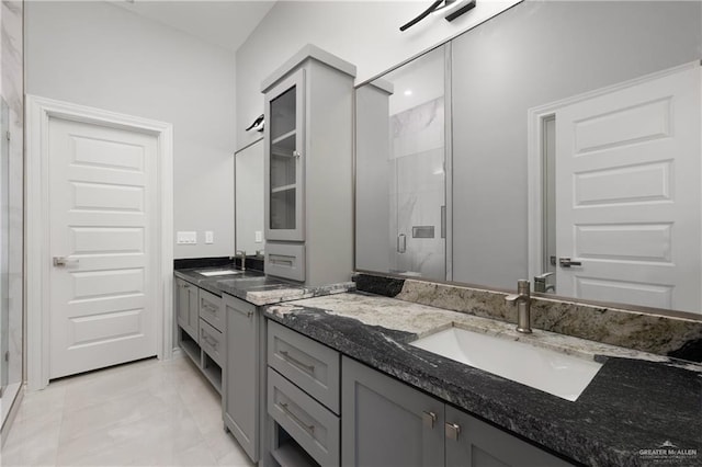 528 Candela St, Edinburg, TX 78542 - full bathroom featuring a stall shower, two vanities, and a sink