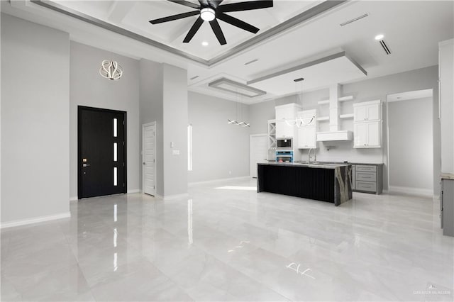 kitchen with open shelves, visible vents, a ceiling fan, open floor plan, and built in microwave