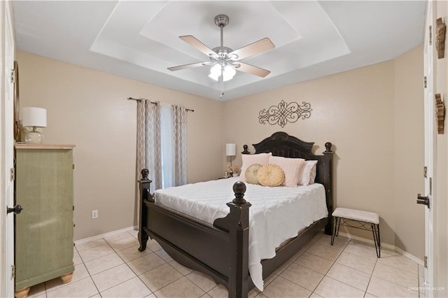 1602 Meadow Ln, Harlingen, TX 78550 - bedroom with a raised ceiling, light tile patterned floors, and ceiling fan