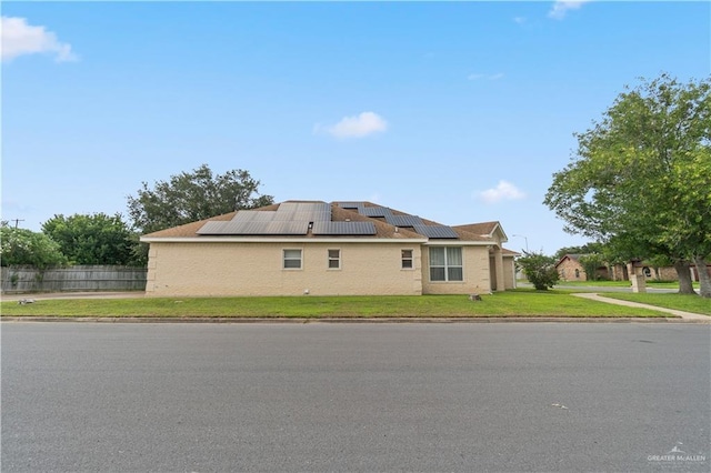 1602 Meadow Ln, Harlingen, TX 78550 - view of property exterior with solar panels